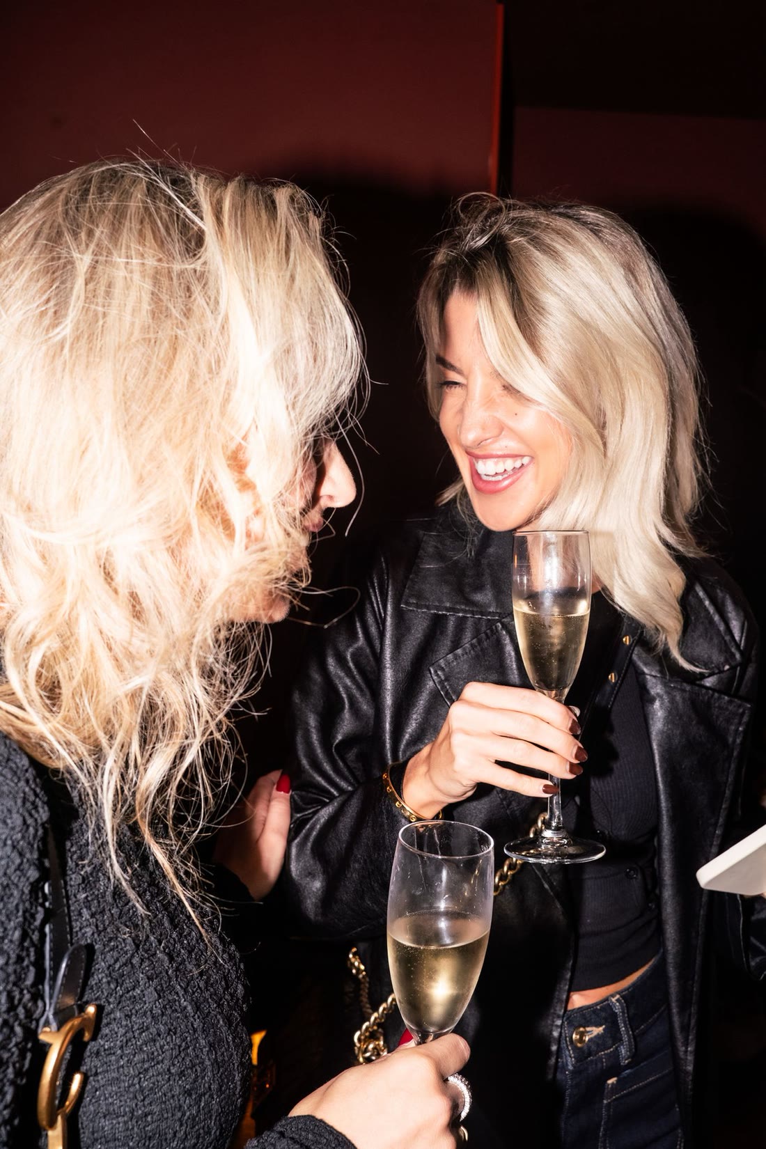 Two members raising a glass at a London Laundry Club evening