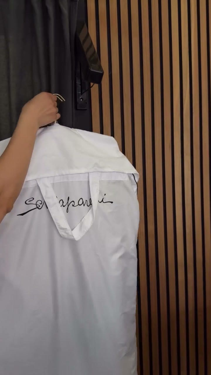 The jacket returned in its Schiaparelli garment cover